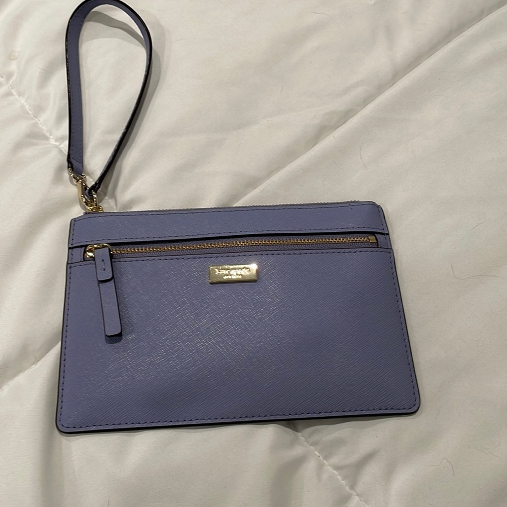 Kate, spade, small wristlet, never been worn, purpleish blue color